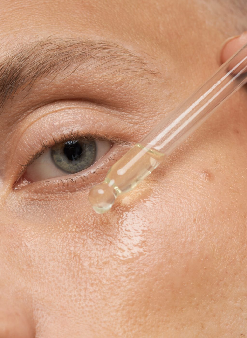 Men's skin care. Close-up facial procedure for a model. Vitamins for the restoration and renewal of the face. High quality photo
